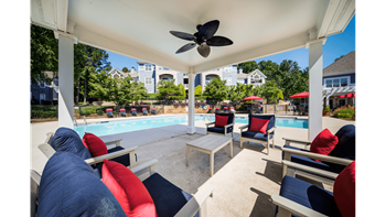 Poolside pavilion w/seating & umbrellas