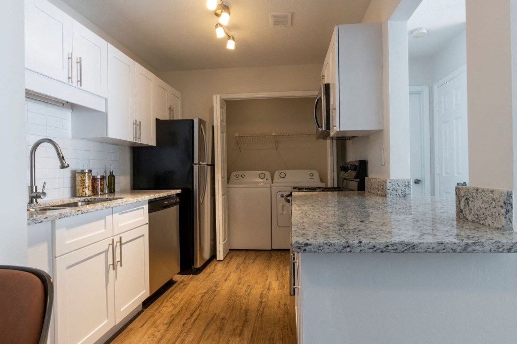 Webb Bridge Crossing Apartments in Alpharetta Georgia photo of kitchen with hardwood flooring