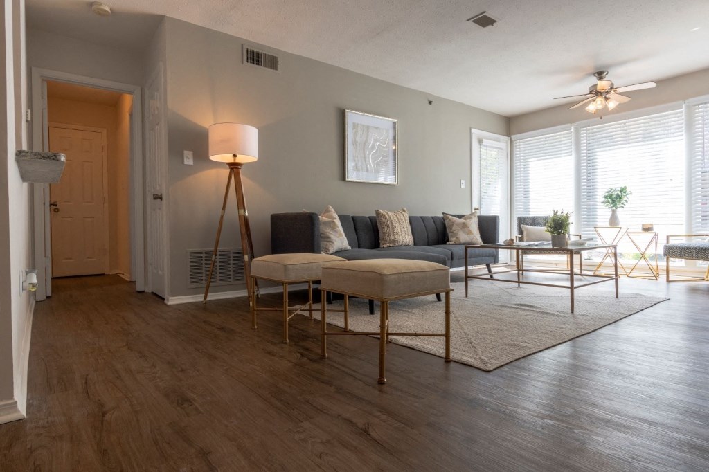 Webb Bridge Crossing Apartments in Alpharetta Georgia photo of a living room with hardwood floors and grey walls