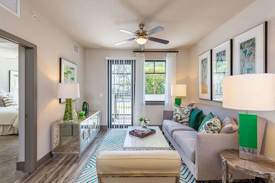 The Edge at Flagler Village Apartments in Fort Lauderdale, FL photo of a living room with a couch and a ceiling fan
