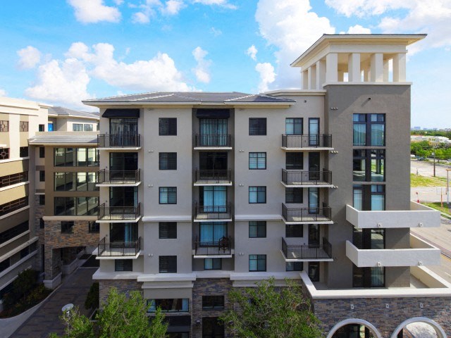 The Edge at Flagler Village Apartments in Fort Lauderdale, FL photo of a view of a building with balconies and a blue sky