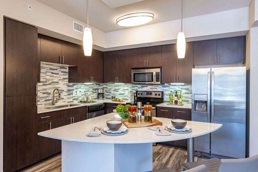 The Edge at Flagler Village Apartments in Fort Lauderdale, FL photo of a kitchen with stainless steel appliances and a counter top