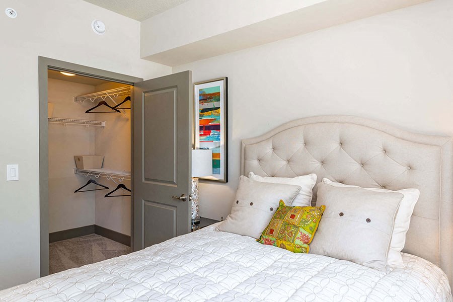 The Edge at Flagler Village Apartments in Fort Lauderdale, FL photo of a bedroom with a bed and a closet
