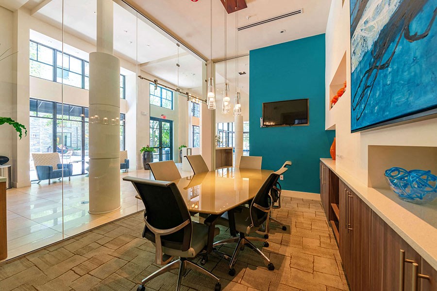 The Edge at Flagler Village Apartments in Fort Lauderdale, FL photo of a conference room with a wooden table and chairs