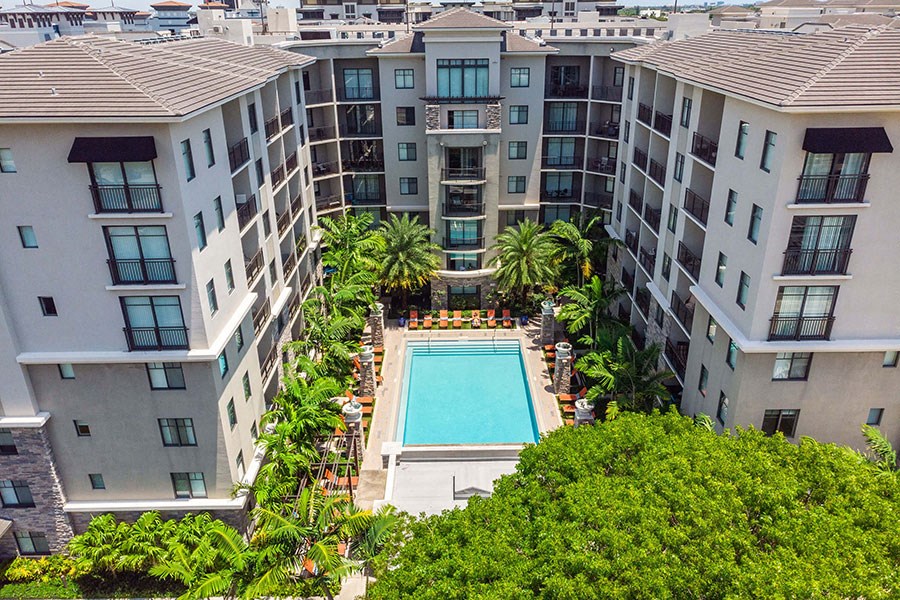 The Edge at Flagler Village Apartments in Fort Lauderdale, FL photo of an overhead view of a pool in the middle of an apartment building