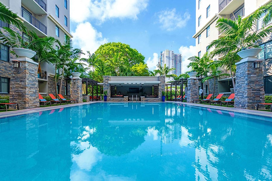 The Edge at Flagler Village Apartments in Fort Lauderdale, FL photo of a swimming pool in the middle of two buildings