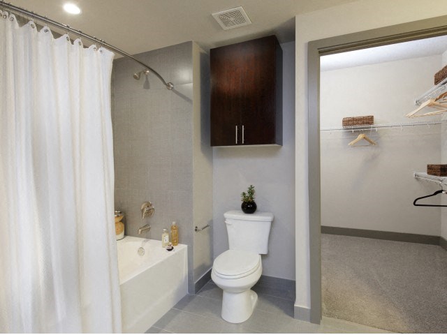 The Edge at Flagler Village Apartments in Fort Lauderdale, FL photo of bathroom shower and toilet