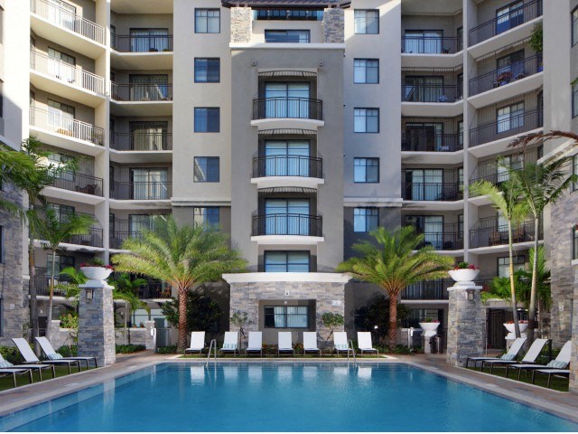 The Edge at Flagler Village Apartments in Fort Lauderdale, FL photo of pool with view of community building