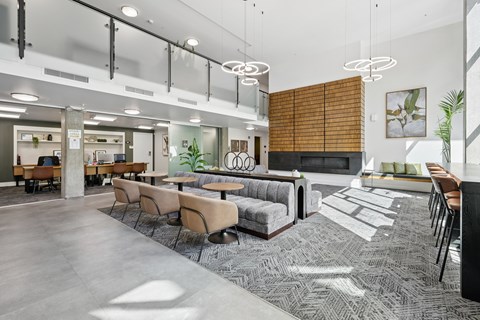 A modern office space with a long table and chairs.