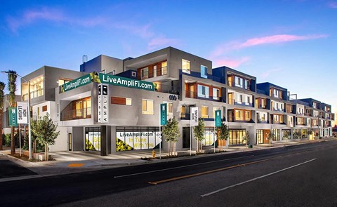 a rendering of the luana inn on a city street
