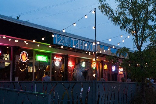 a restaurant is lit up at night