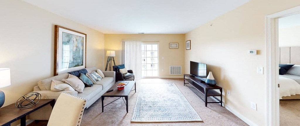 a living room with a couch and a tv