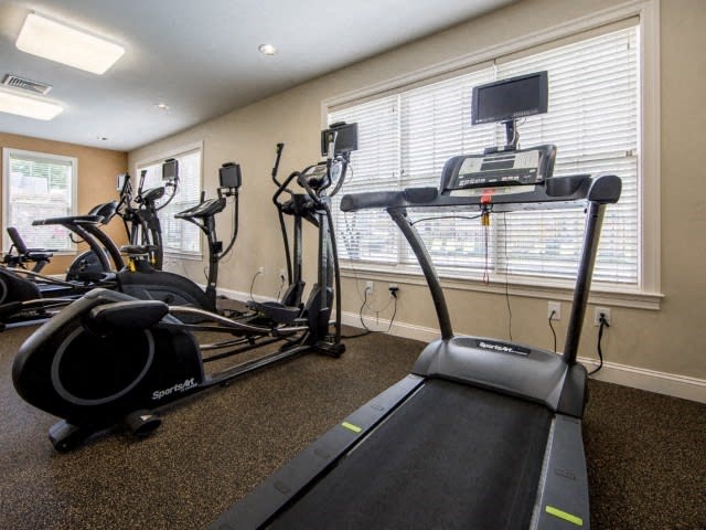 a room filled with lots of exercise equipment