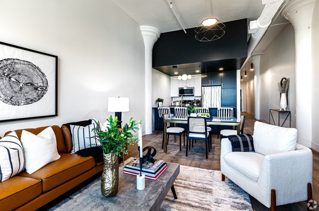 a living room and dining room with a couch and a table