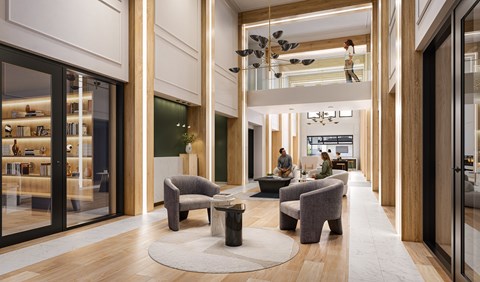 A modern living room with a long white rug and grey chairs.