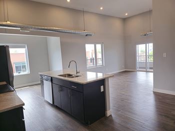 A kitchen with a sink and a window.