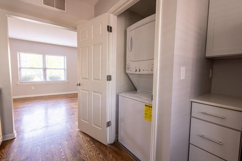 a small laundry room with a washer and dryer