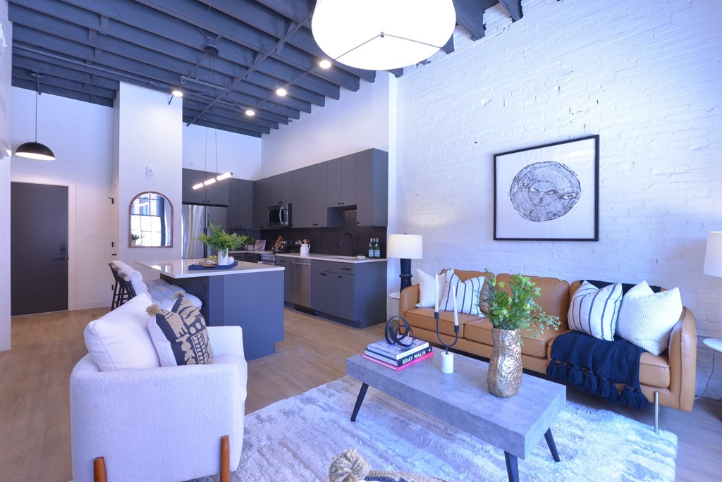 A living room with a couch, chair, and coffee table.