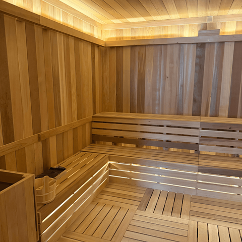 A sauna with wooden benches and walls.