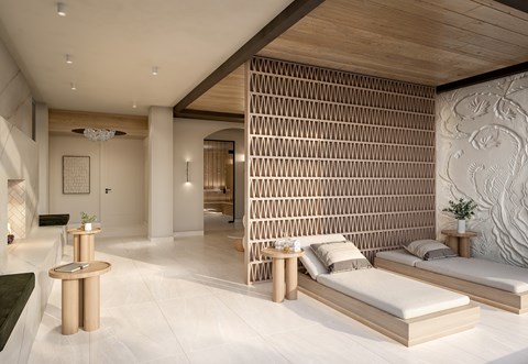 A modern spa room with a wooden wall panel and white flooring.