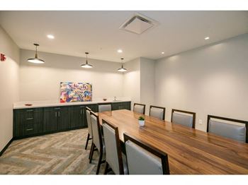 a conference room with a long table and chairs