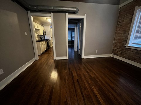 Room with view into kitchen and bedroom