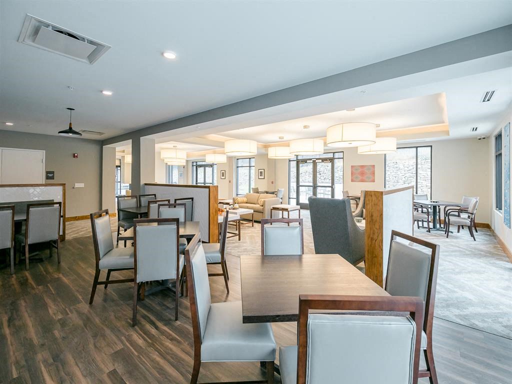 a restaurant or other place to eat at homewood suites by hilton houston staff