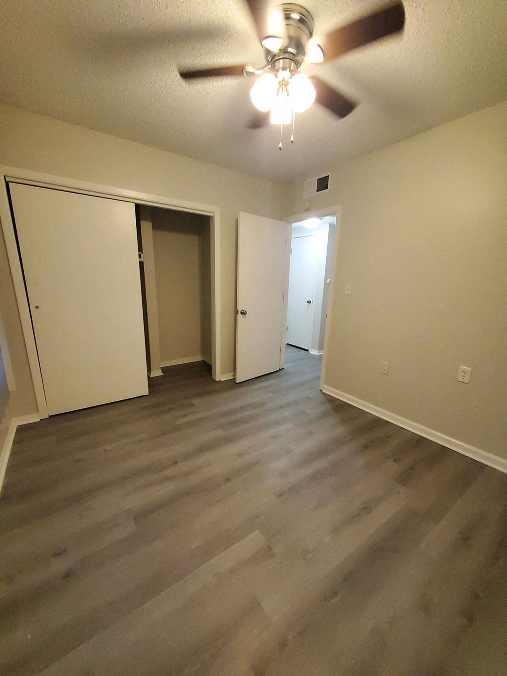 the view from the top of the stairs looking down into the closet