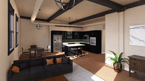 A living room with a black couch and a pineapple on the carpet.