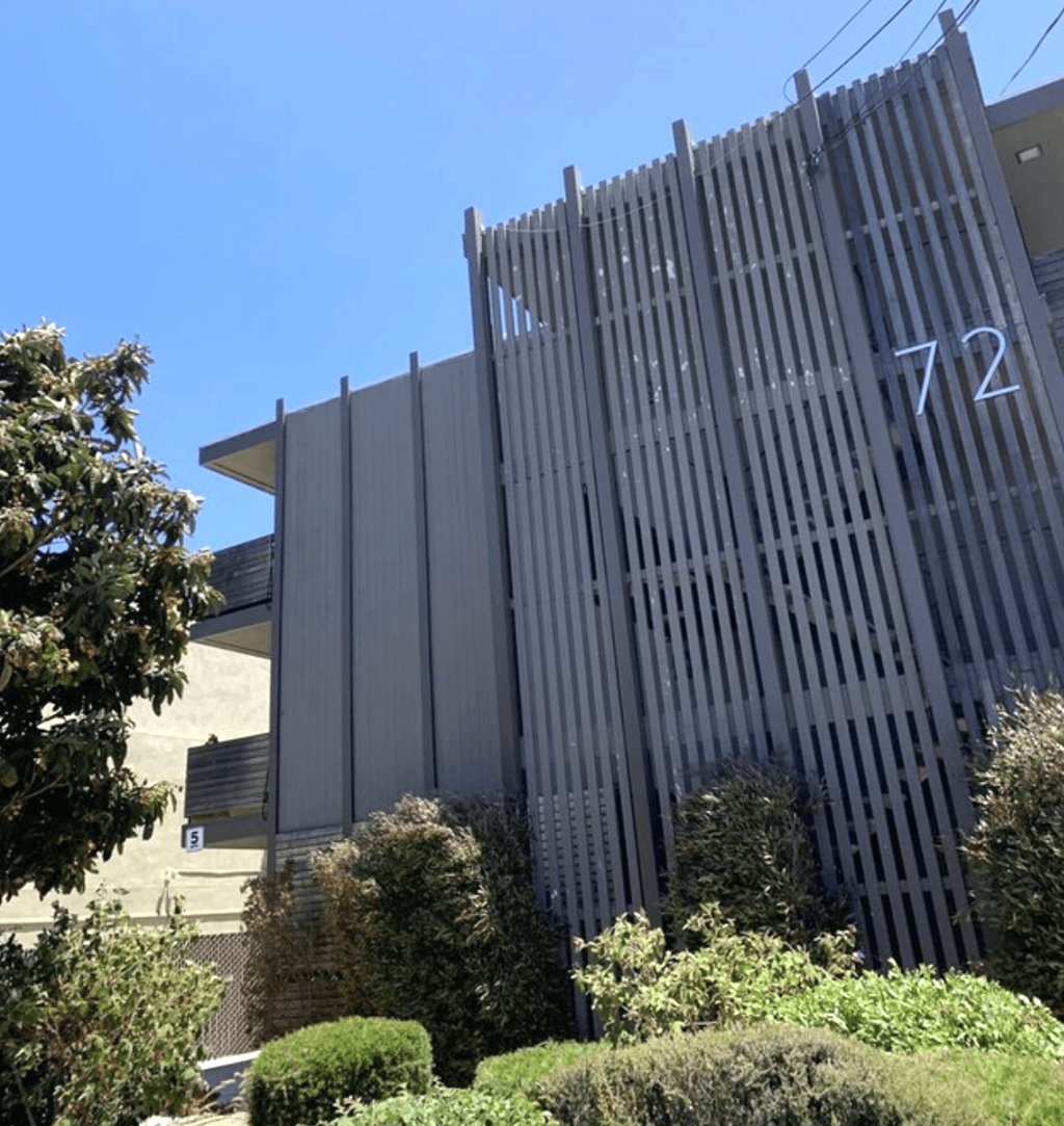 A tall building with the number 72 on it.