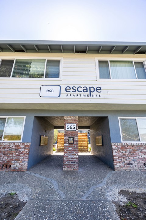 the entrance to the escape apartments building