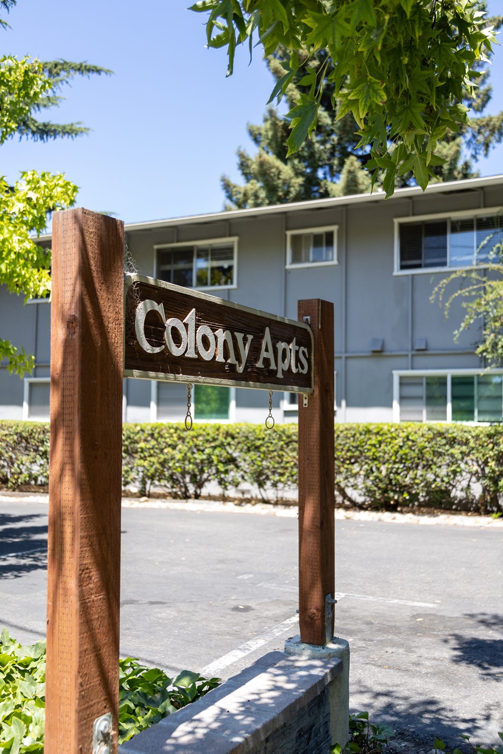 a sign that reads colony arts in front of a building