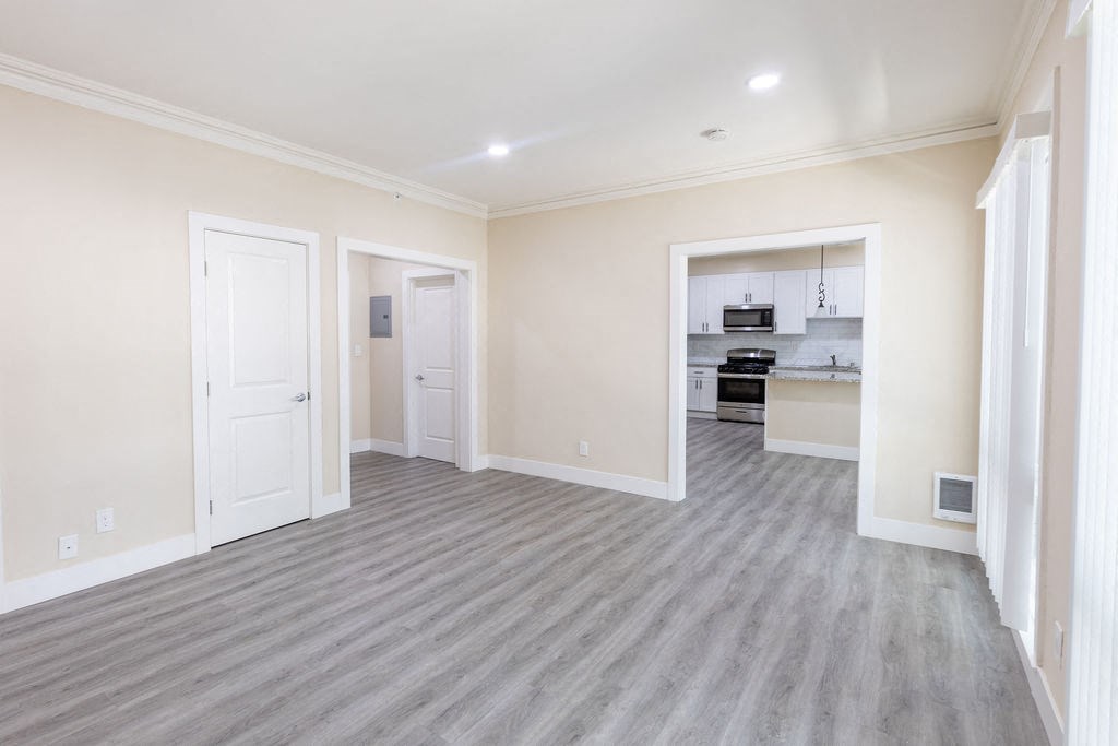 the living room and kitchen of a new home