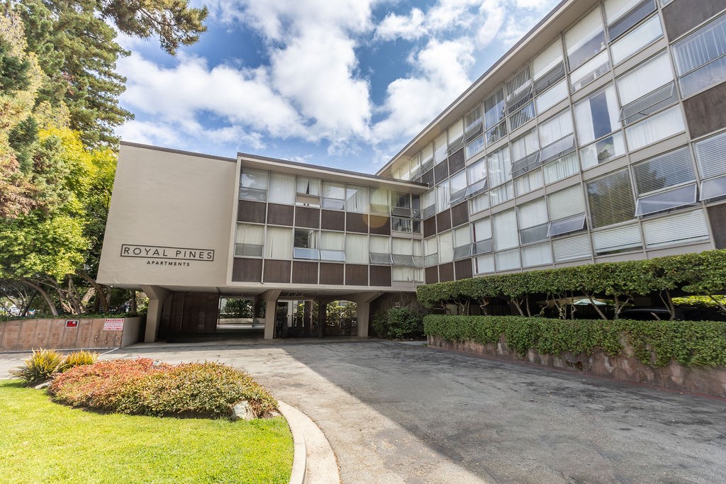 The building is called Royal Fines and it is a large, modern structure with a lot of windows.