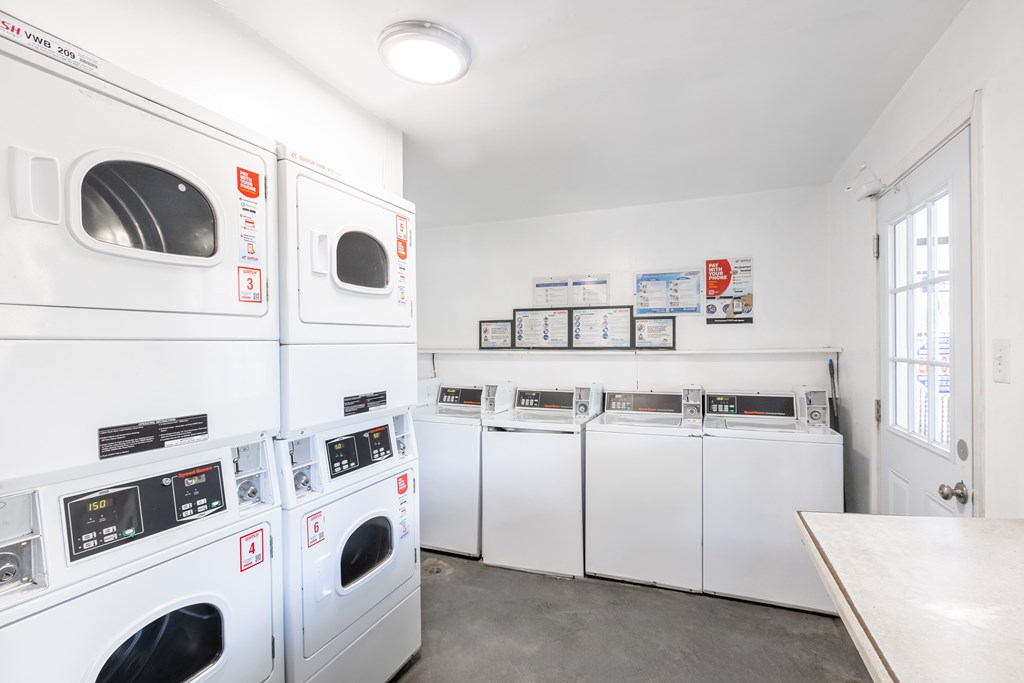 A laundromat with washers and dryers.