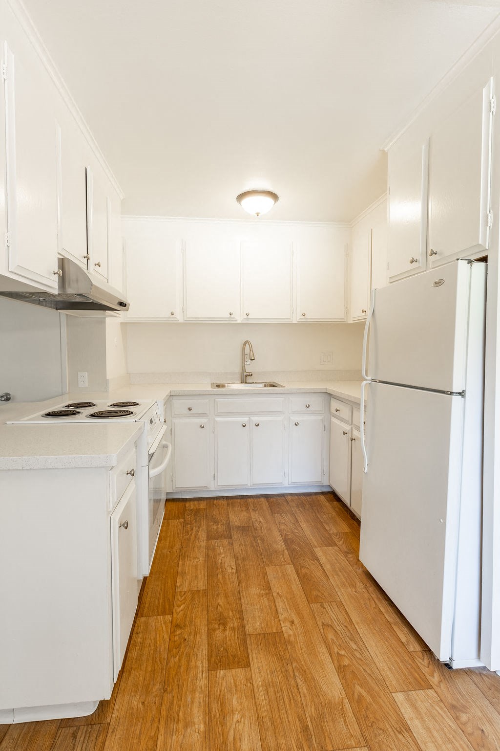 a room with white walls and a wooden floor