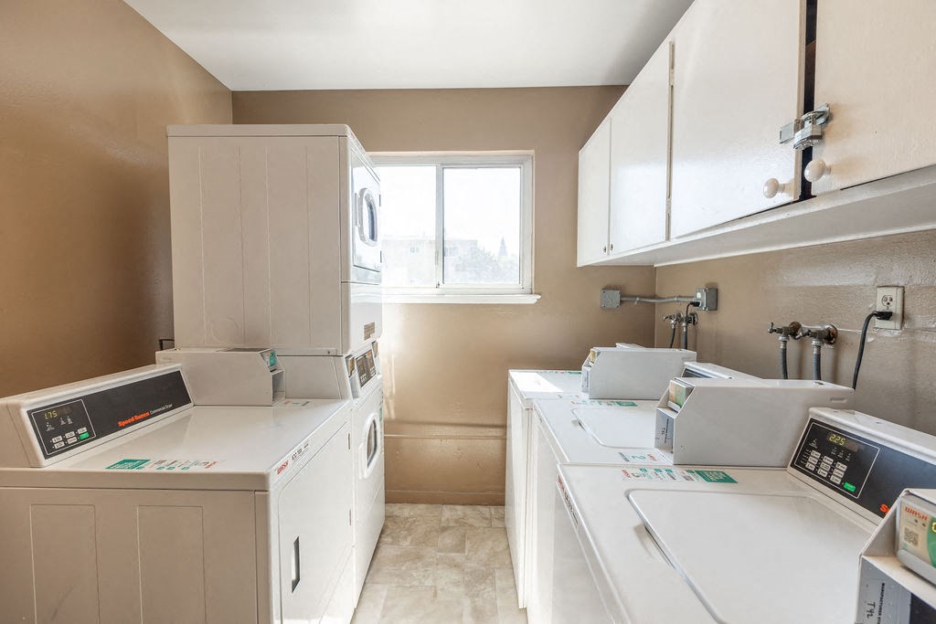 a kitchen with white appliances and white cabinets