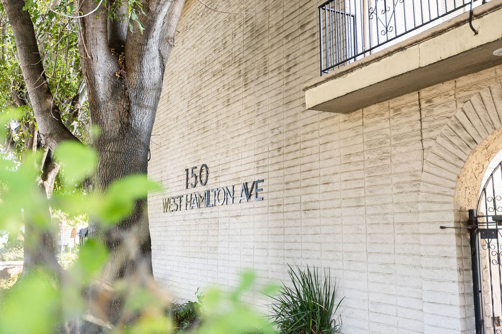 a sign on the side of a brick building