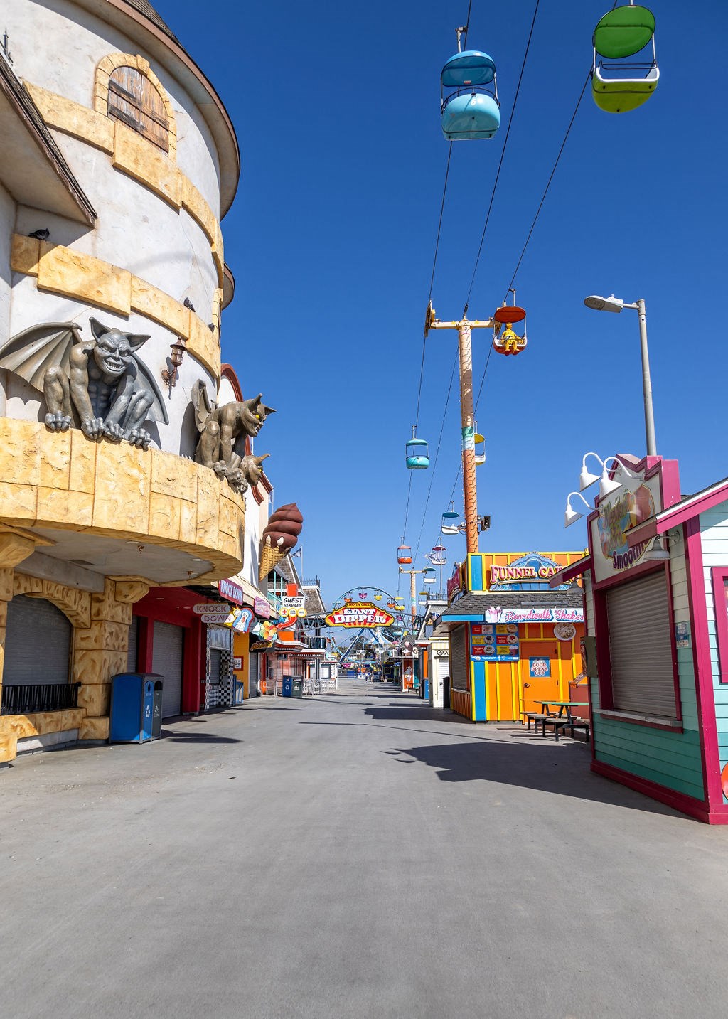 a street with a ferris wheel in the middle of it