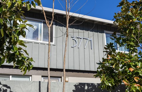 A grey building with the number 3771 on it.