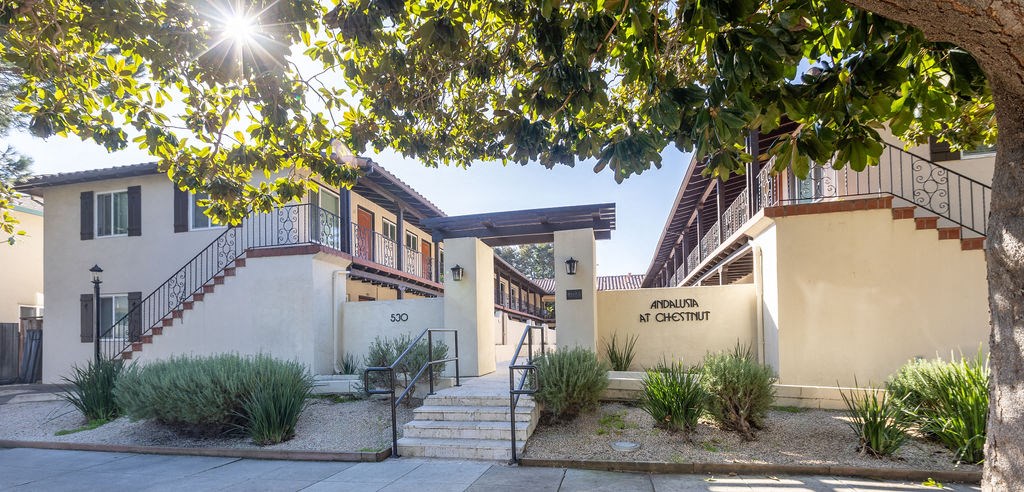 A sunny day in front of a building with a sign that says "Chestnut Hill".