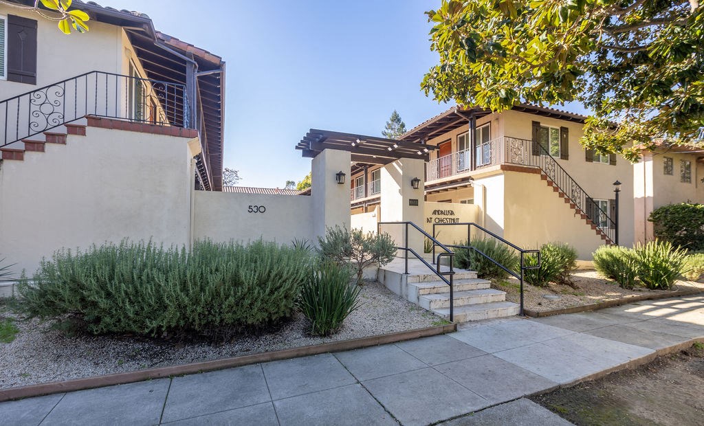 A house numbered 5300 with a green bush in front.