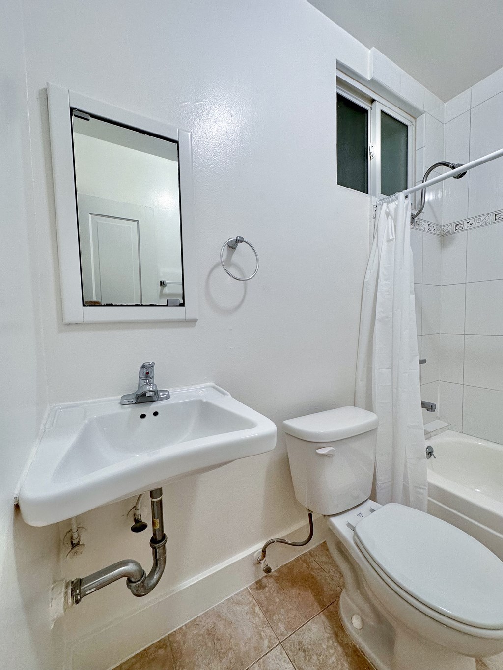 a bathroom with a sink toilet and bathtub
