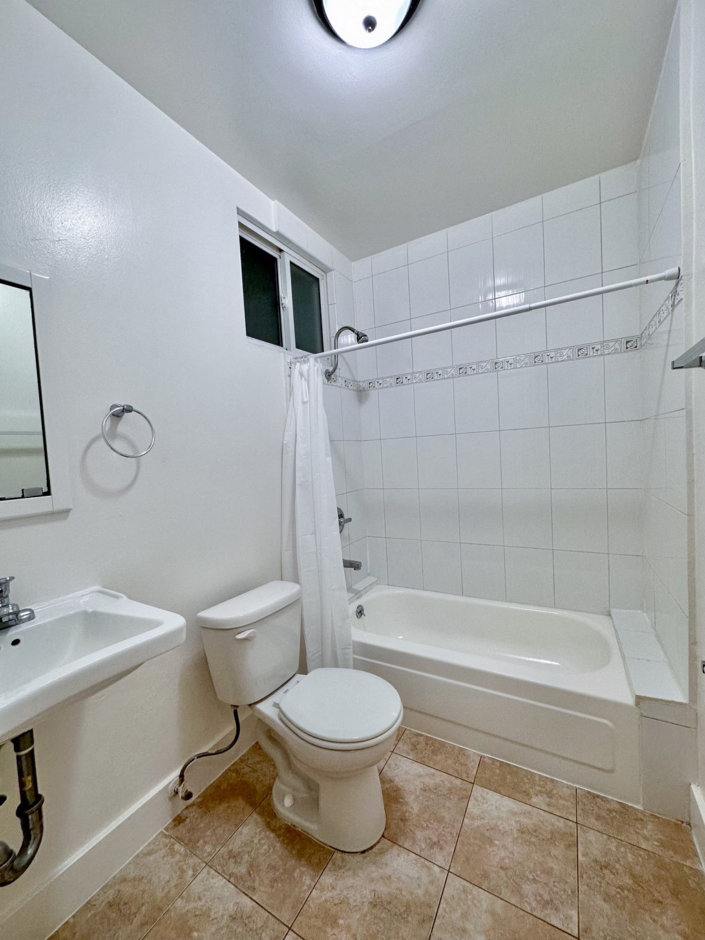 a bathroom with a toilet sink and bathtub