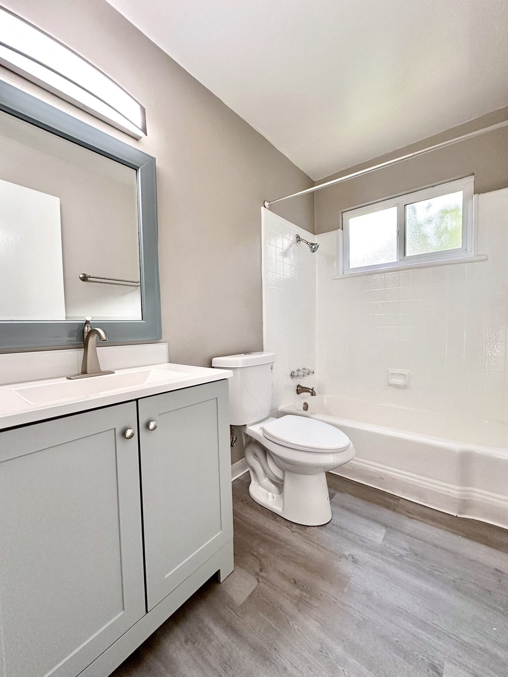 an empty bathroom with a toilet and a sink