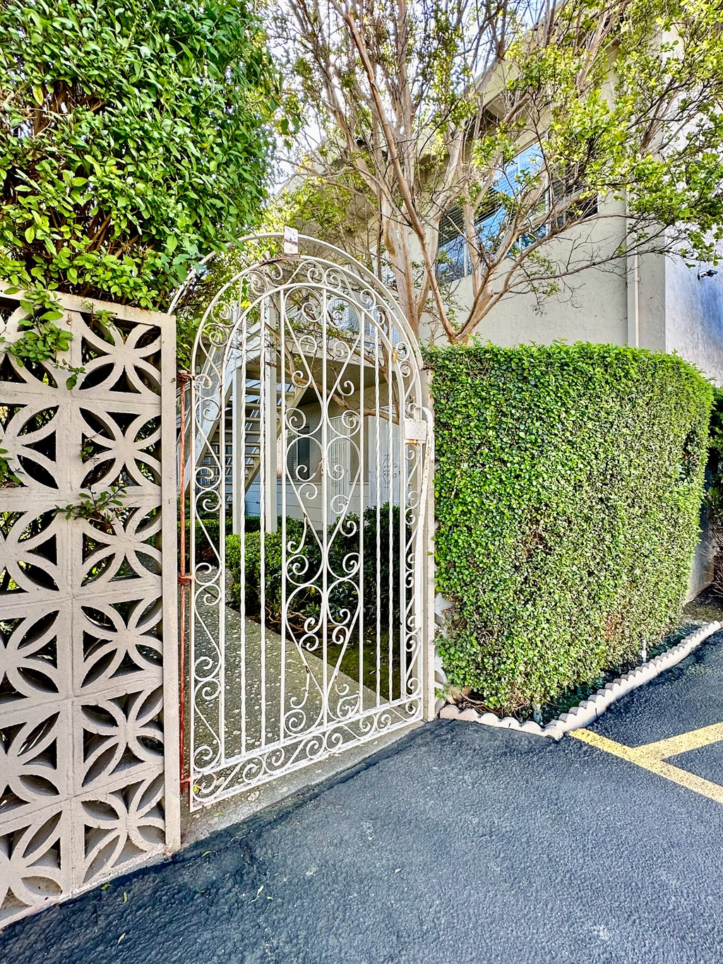 a wrought iron gate in front of a house