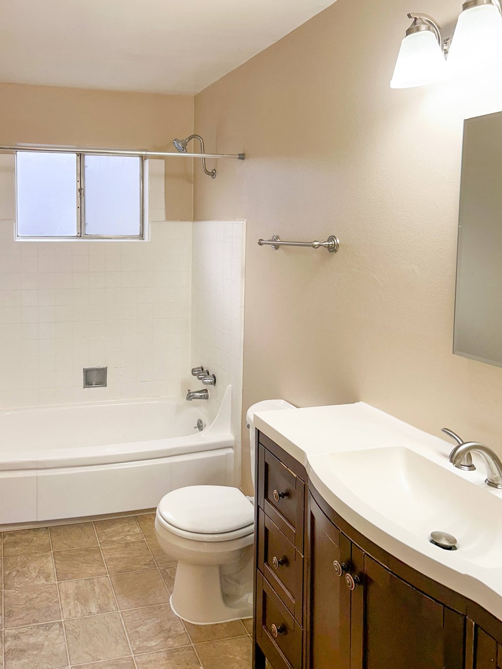 a bathroom with a sink toilet and a bath tub