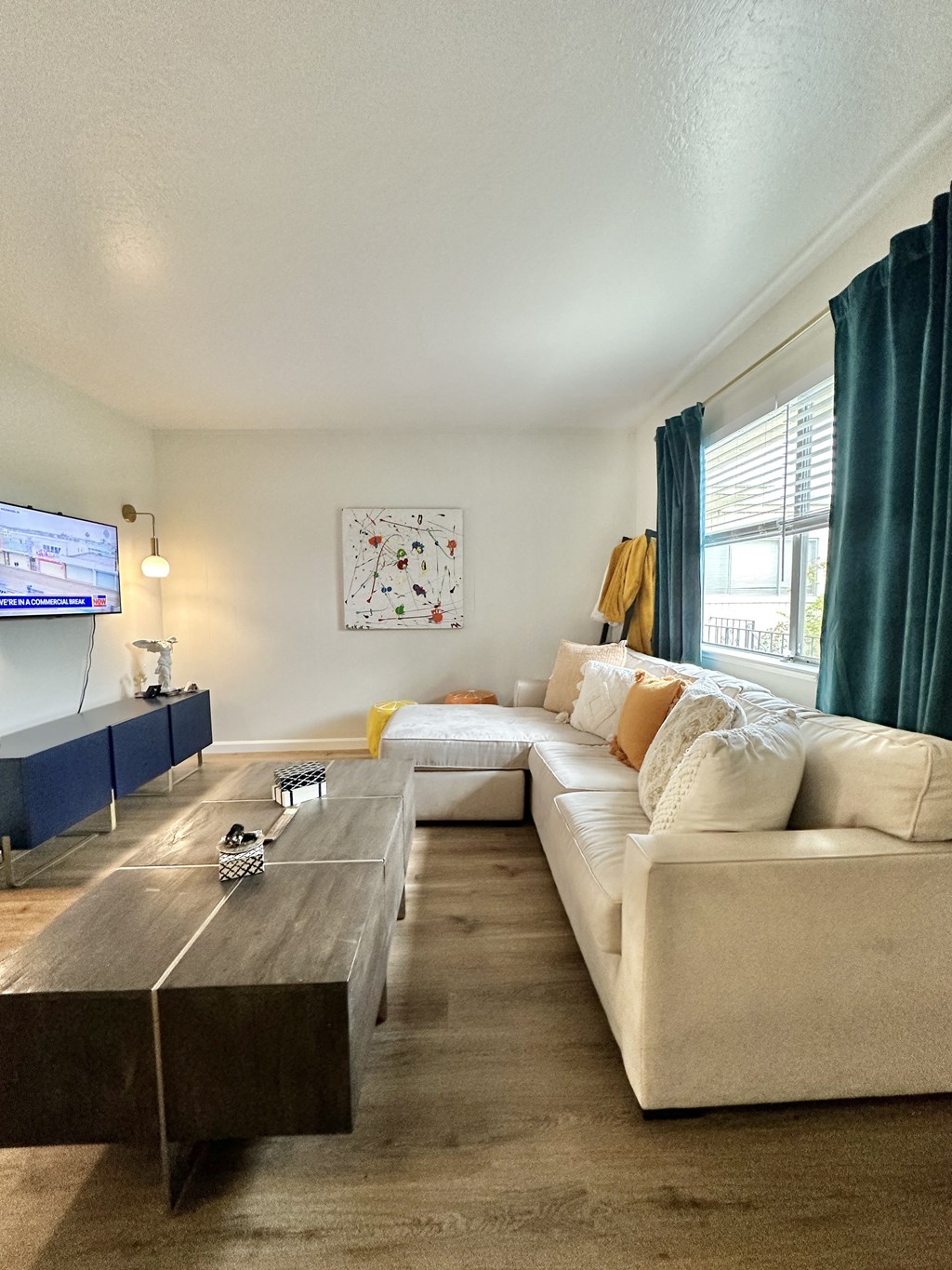 a living room with a couch and a coffee table and a tv