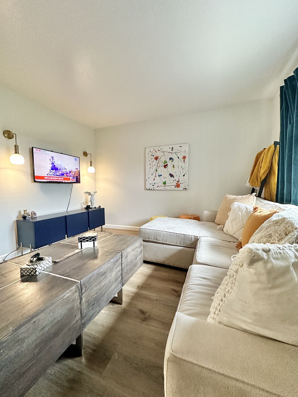 a living room with a couch and a tv