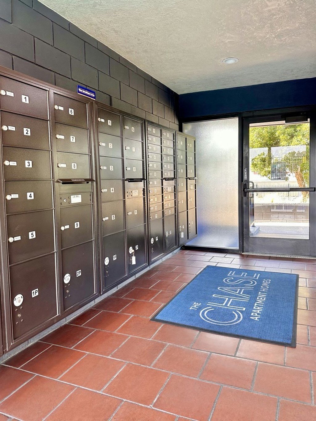 a bunch of lockers in a room with a door